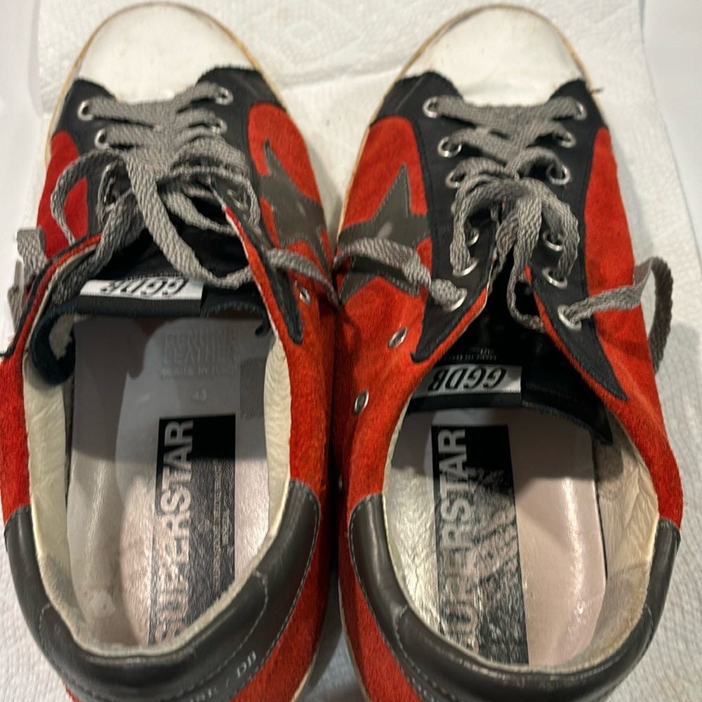 Red mens golden Goose superstar sneakers.